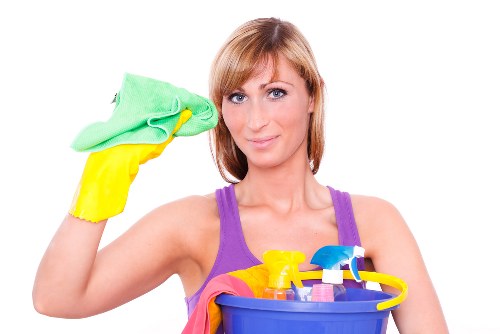 Professional carpets cleaner in Chelsea removing dirt from a living room carpet