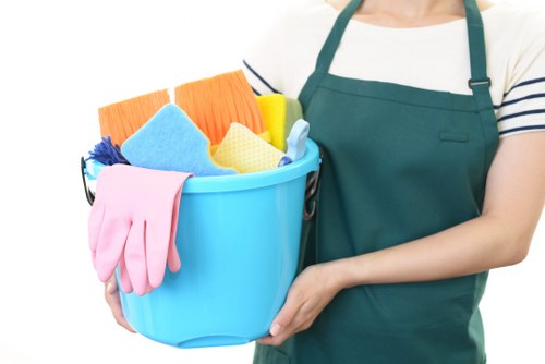 Professional office cleaners working in a Chelsea office reception area